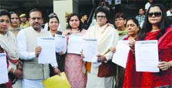 President of the BJP Delhi unit Vijendra Gupta along with party women activists, shows the copy of the memorandum submitted to the Delhi police commissioner at PHQ in New Delhi