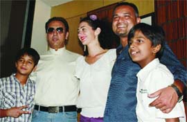 Actor Gulshan Grover along with Beatrice Ordeix, director of film I am Kalam, and other actors, Nila Madhab Panda, Master Harsh Mayar and Master Husaan Saad, poses at a special screening of the film at Constitution Club in New Delhi 