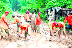 Workers clear the Haridwar-Dehradun railway line on Tuesday in Haridwar