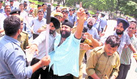 Members of the Central University Joint Action Committee hold a protest in Jammu on Tuesday.