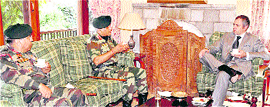 Chief Minister Omar Abdullah (right) with the Chief of the Army Staff, Gen VK Singh (second from left) during a meeting in Srinagar on Tuesday.