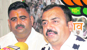 BJP state convener of the trade and industry cell Vikram Randhawa addresses a press conference in Jammu on Tuesday.