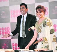 Stiff competition: Madhuri Dixit with Sanjeev Kapoor