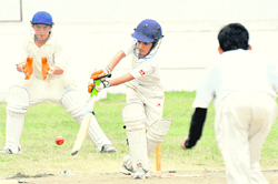A batsman plays a shot during the St Josephs Cricket Trophy in Chandigarh