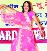 A woman takes part in the Teej celebrations in Dehradun 