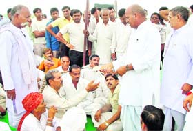The panchayat at Ullawas village deliberates over leasing of land to Rajiv Gandhi Charitable Trust in Gurgaon