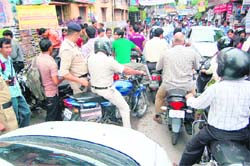 A traffic jam on the road in front of DAV College in Dehradun.