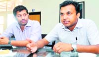 Sukhwinder Singh (right) and Randeep Baruah, both sports promoters, address a press conference in Dehradun 