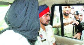 Jora Singh (L), who attacked VC of Guru Granth Sahib World University Jasbir Singh Ahluwalia, talks to mediapersons 