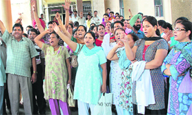 Paramedical staff protest against the Director, Health, Dr Ashok Nayyar, outside the Civil Hospital in Jalandhar.