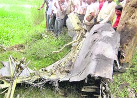 Villagers near the wreckage of a Jaguar fighter aircraft that crashed in Dilahi Firozpur village of Uttar Pradeshs Mau district on Thursday