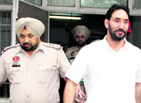 Councillor Sukhmeet Singh Deputy coming out of a local court after being sentenced to life imprisonment in Jalandhar on Thursday