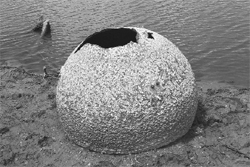 A cryogenic tank from the Space Shuttle Columbia is shown in this handout photo released to Reuters on August 3, 2011. The tank was discovered in an evaporating lake bed on the shoreline of Lake Nacogdoches in east Texas, part of debris from the 2003 Columbia disaster 