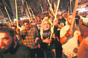 Lebanese Islamists shout slogans as they march during a protest in solidarity with Syria's anti-government protesters, in Tripoli, northern Lebanon