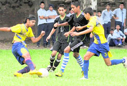 Players vie for the ball during a football match at Government Model Senior Secondary School, Sector 22, Chandigarh