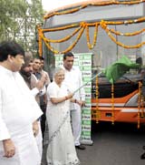 Delhi Chief Minister Sheila Dikshit flags off a cluster bus at the Delhi Secretariat  in New Delhi on Friday.