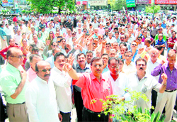 Bank employees stage a protest in Dehradun on Friday