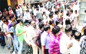 Students queue up to get application forms for the Haryana Teachers Eligibility Test in Rohtak on Friday.