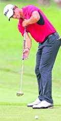 First round leader Adam Scott makes a birdie putt at the WGC Bridgestone Invitational PGA tournament in Ohio