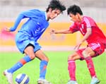Indias Myron Mendes (L) and Maldives Ahusan Ibrahim tussle for the ball during their SAFF u-16 match in Kathmandu 