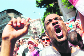 A protester raises slogans against President Bashar al-Assad during a demonstration by Egyptians and Syrians outside Syrias embassy in Cairo on Friday after Syrian security forces killed at least four persons and wounded several others when they opened fire to disperse demonstrators near Damascus.
