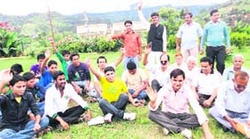 Members of youth organisations hold a protest against the state governments proposed move on domicile certificates, in Pithoragarh on Saturday