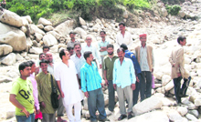 Sambal flash-flood victims show damages to their land to BJP leader Praveen Sharma