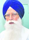 Former SGPC chief Kirpal Singh Badungar with his book in Patiala.