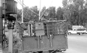 a back-up transformer positioned on a trailer along a road poses a threat to the lives of commuters at Balongi, Kharar