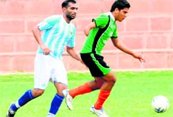 Players in action during a match of the Instituitional Four-Team Football League Tournament in Chandigarh on Sunday. 