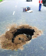 Road caved in on K.G.Marg near Connaught Place in New Delhi on Sunday.