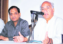 National vice-president of the BJP Shanta Kumar, along with Industries Minister Kishan Kapoor, addresses a press conference at Dharamsala on Sunday. 