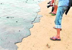 Contaminated water on the Juhu Chowpatty beach in Mumbai on Sunday