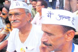 Supporters of Anna Hazare take part in a demonstration against the Lokpal Bill introduced by the government in Parliament, at Jantar Mantar in New Delhi on Sunday