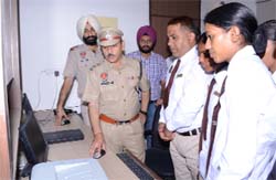 SSP RK Sharda operates a computer at the CPSC in Abohar.