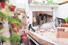UT estate office employees carry out a demolition drive at a house in Sector 9, Chandigarh,