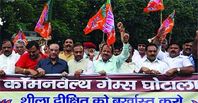 BJP leaders along with party workers hold a protest against Delhi Chief Minister Sheila Dikshit in New Delhi on Monday.