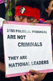 Pro-democracy Burmese activists protest to commemorate the 23rd anniversary of the peoples uprising, in New Delhi on Monday.