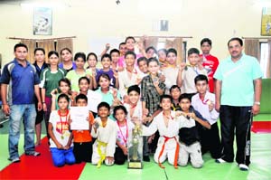 Members of the Dehradun district team that won the State Judo Championship, in Dehradun on Monday.