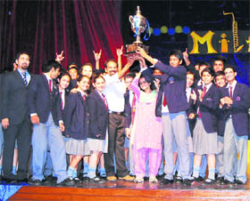 Participants of St Joseph's Academy who won the Champion of Champions trophy in Mussoorie on Monday. 