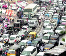 Vehicles stuck in a traffic jam after a downpour in Gurgaon on Monday.