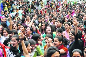 Girls dance at a DJ party organised at the RKMV in Shimla on Monday