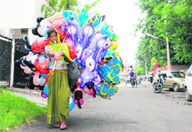 A woman sells Chinese toys in Karnal.