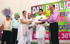 MP Ashok Tanwar confers the Avantika Award on Indu Sharma, principal of the Akal Academy, Ratia, at a function in the town.
