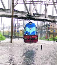 Monsoon Blues: A train on a waterlogged track in Kolkata on Monday