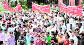 Cloth merchants hold a protest in Dehradun on Tuesday.
