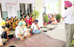 Teachers stage a protest in support of their demands at Guru Nanak Public School, Mullanpur. 