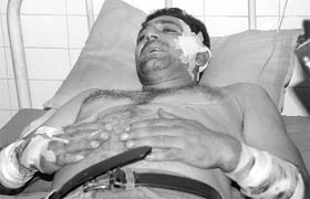 Harish Sharma, who was attacked by unknown persons outside the court complex, admitted to a hospital in Mohali