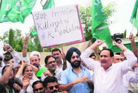 Activists of the PDP protest against the recent Poonch fake encounter in Jammu on Wednesday