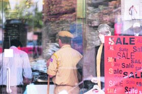 Officials of the Income Tax Department conduct a survey at a showroom in Jammu on Wednesday